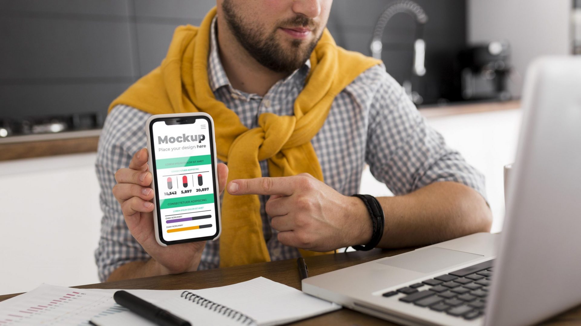 Man at desk with phone mock-up