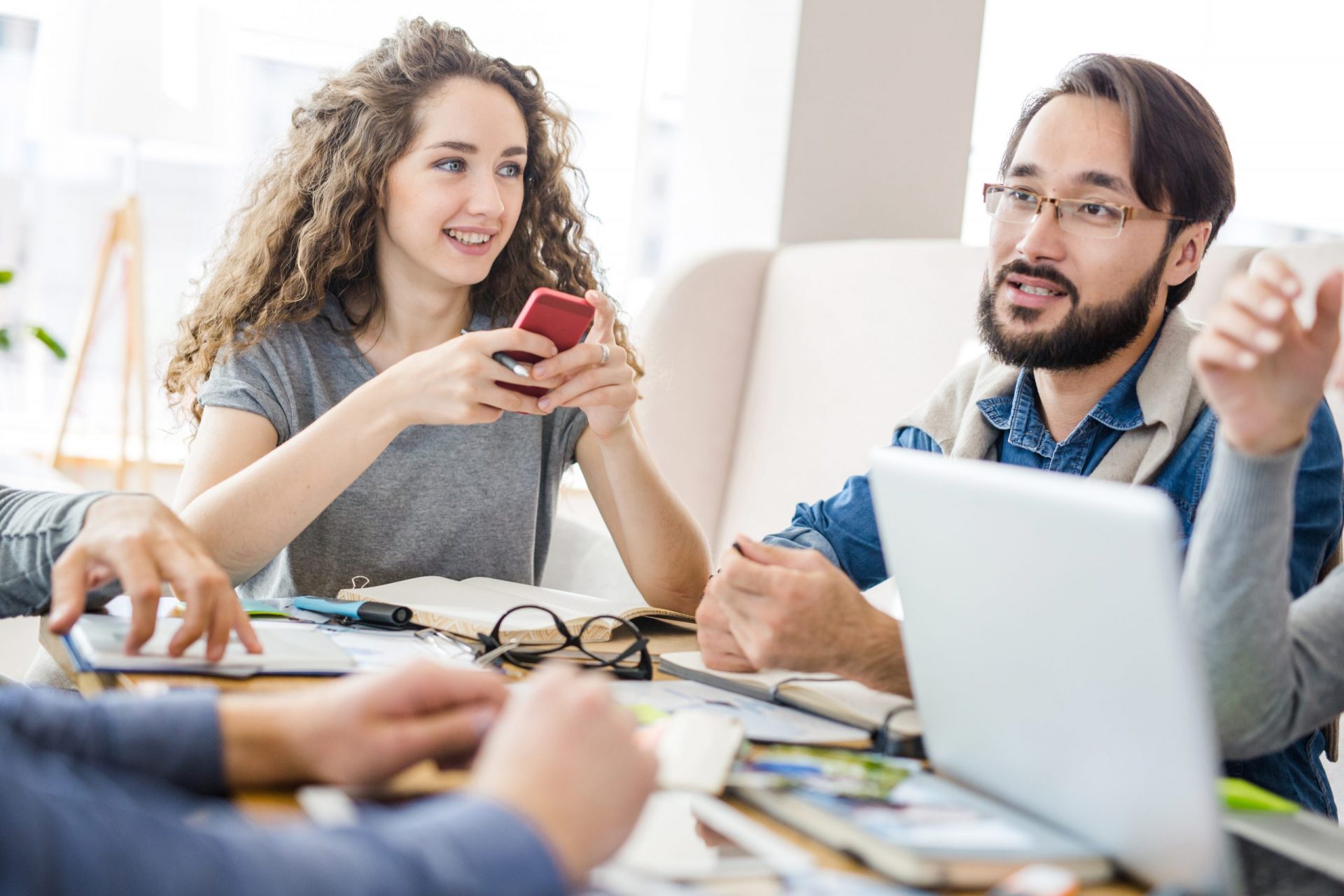 Listening to co-worker while discussing How to Choose the Right App Development Team for Your Budget