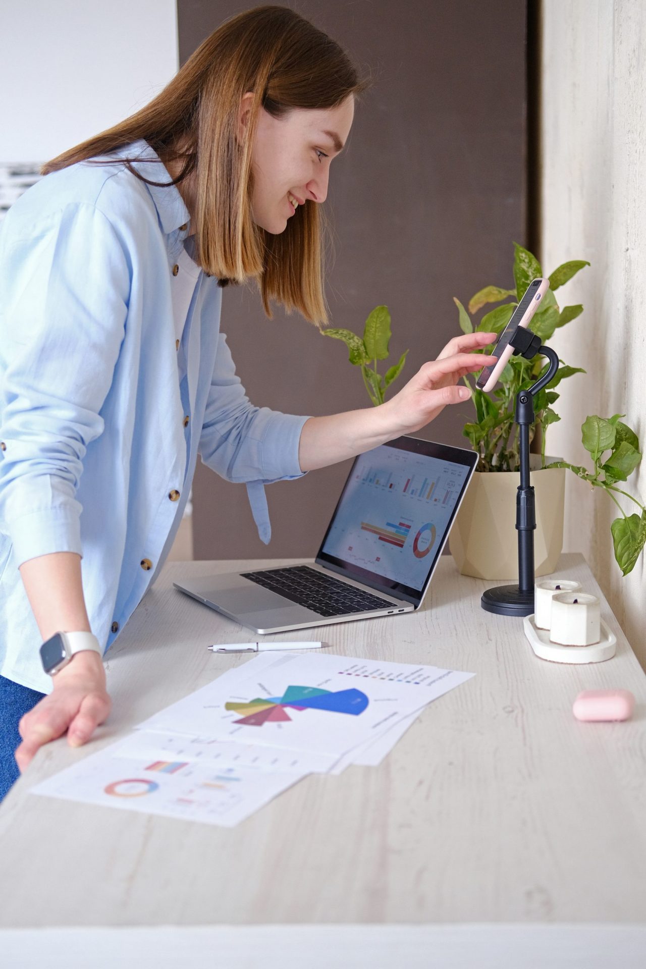 woman-is-looking-laptop-with-plant