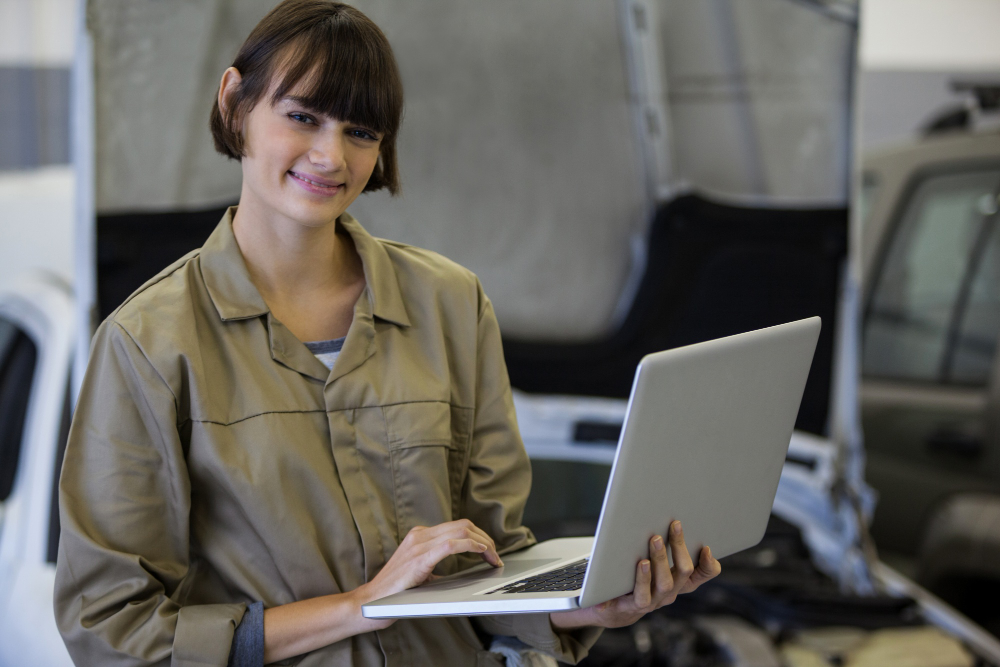 Portrait of female enterprise application developer using laptop