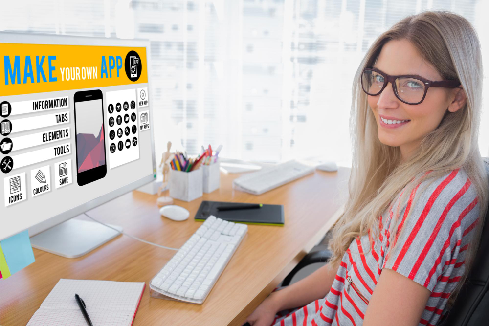 Composite image of attractive android app developer working on computer